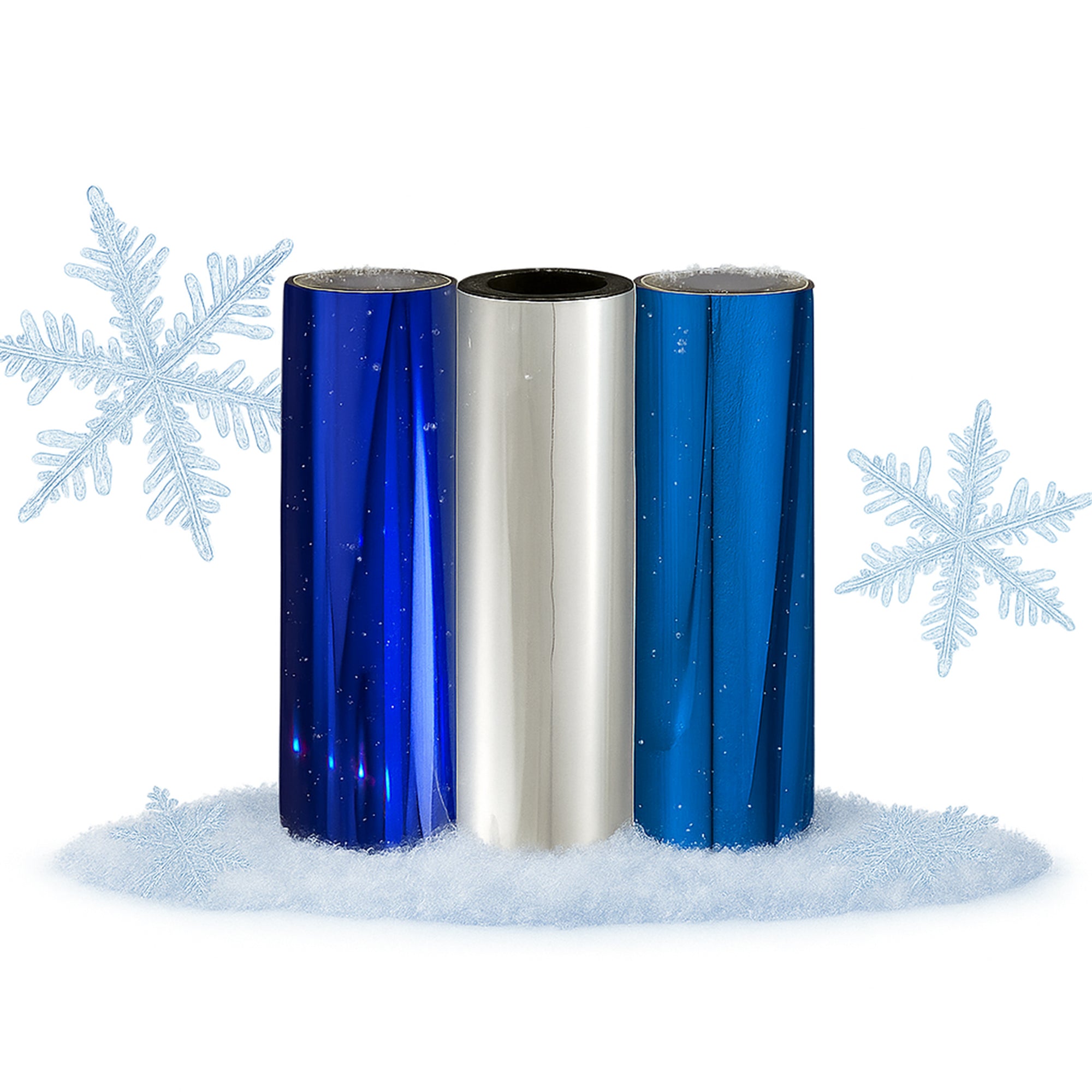 Three toner-foil rolls—holographic blue, metallic silver and sapphire blue—standing on faux snow with pale blue snowflakes.
