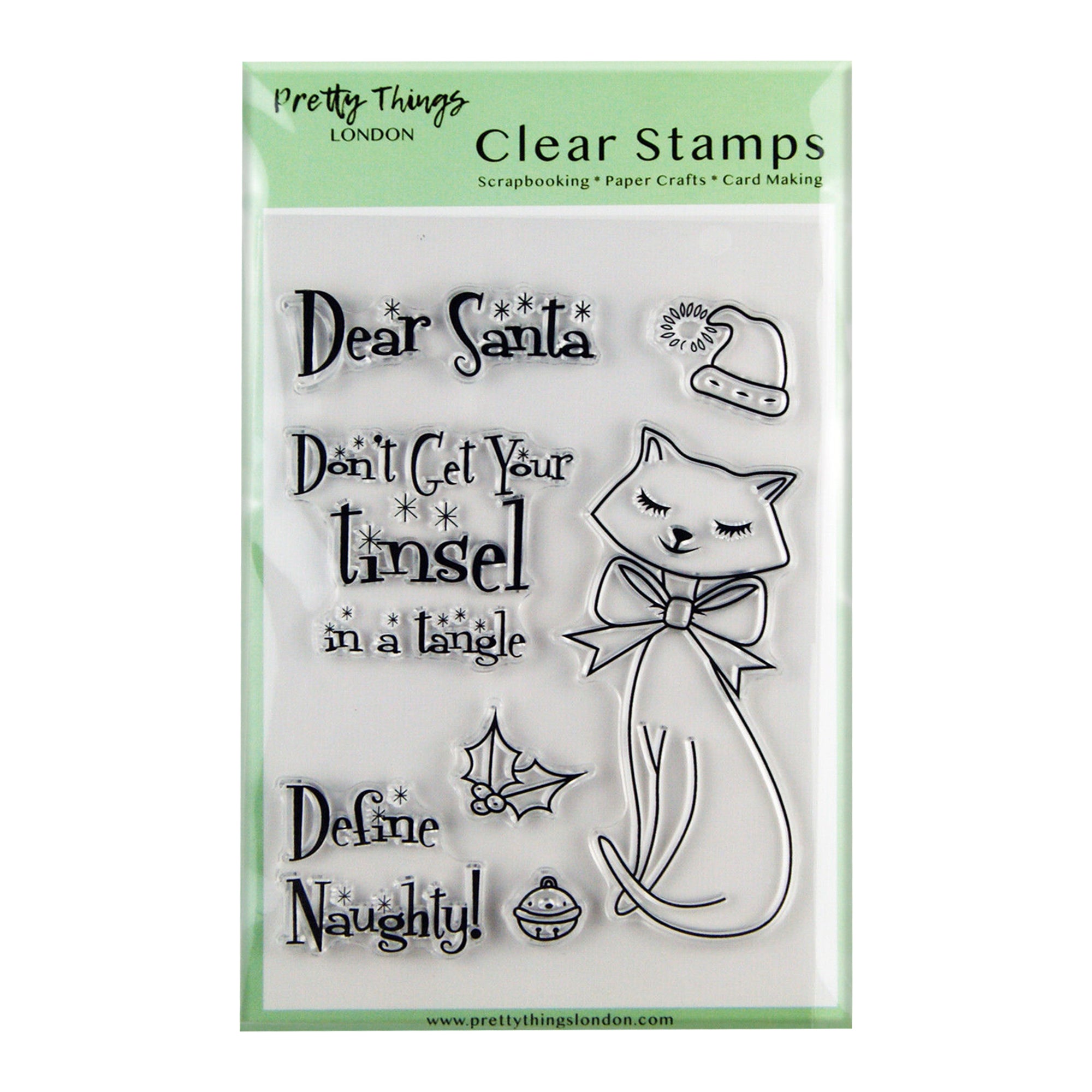 A clear stamp set from Pretty Things London, featuring Christmas-themed designs including the phrases 'Dear Santa,' 'Don't Get Your Tinsel in a Tangle,' and 'Define Naughty!' along with images of a cat with a bow, holly, a Santa hat, and a Christmas ornament.