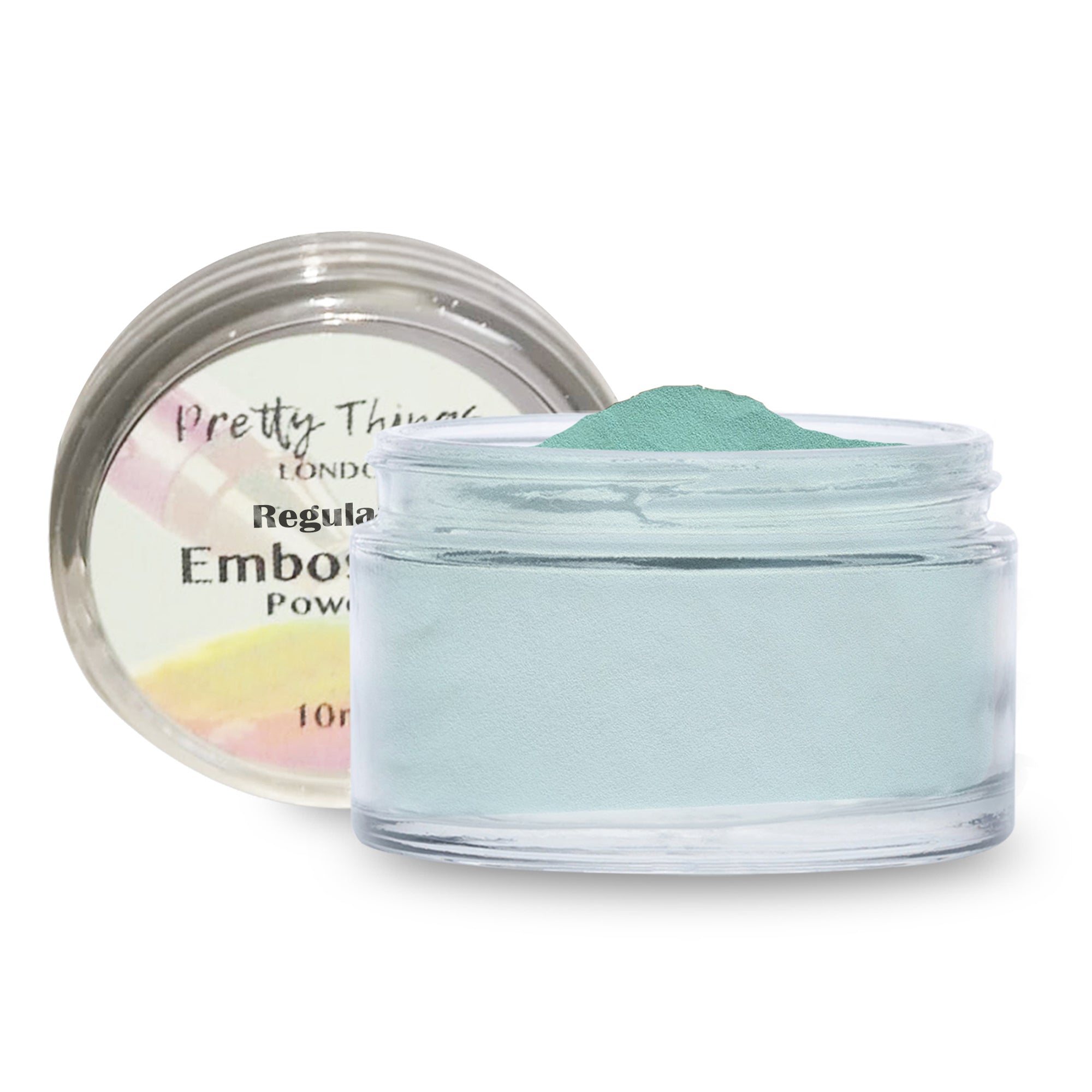 A jar of Pretty Things London Embossing Powder in Green Turquoise Pastel, with the lid off, showcasing the pastel turquoise green powder.