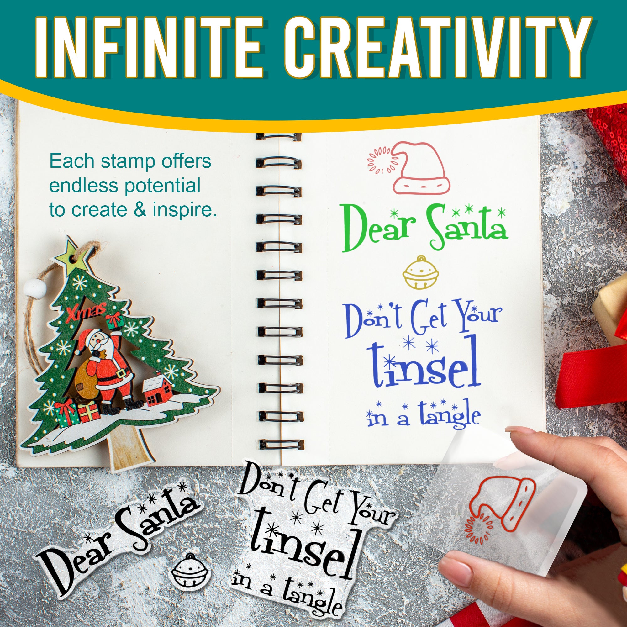 An image showcasing the creative potential of the clear stamp set. The stamps have been used to create colourful Christmas designs in a notebook. The designs include 'Dear Santa,' 'Don't Get Your Tinsel in a Tangle,' and a Santa hat. A hand is shown stamping a red Santa hat on a clear block.