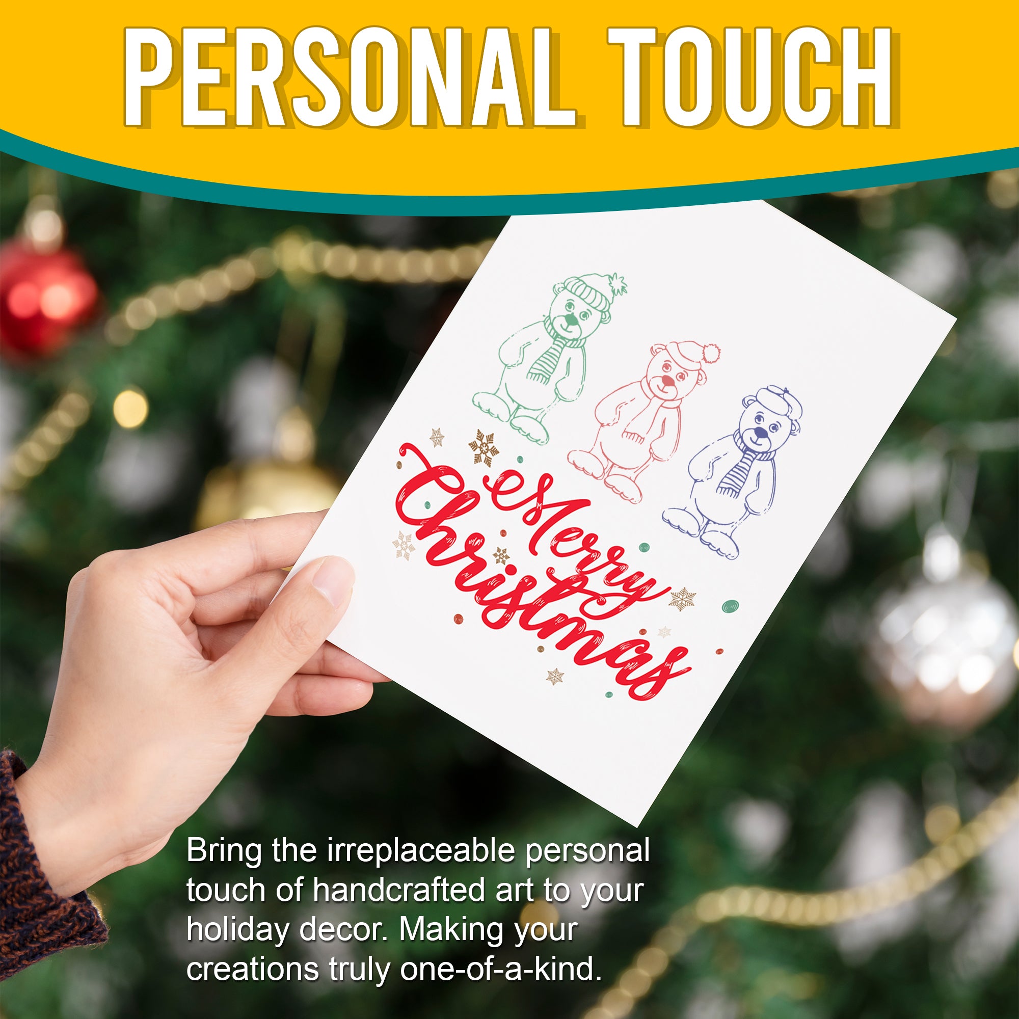 Close-up of a hand holding a Christmas card with three stamped winter bears and 'Merry Christmas' text. The card is placed in front of a decorated Christmas tree, highlighting the personal touch of handcrafted holiday decor.